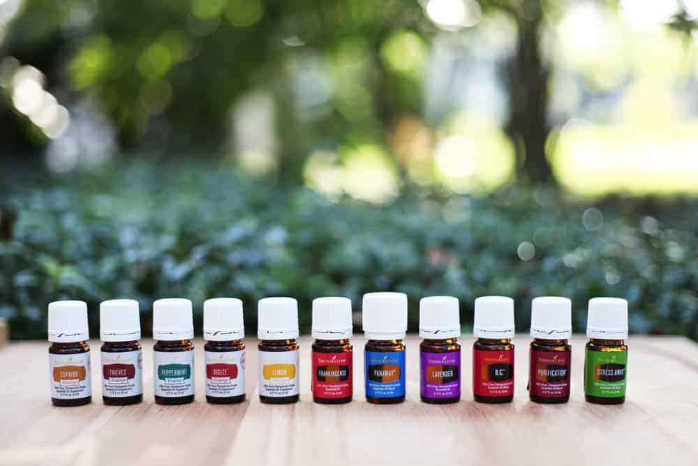 a line of Young Living Essential Oils on an outdoor background